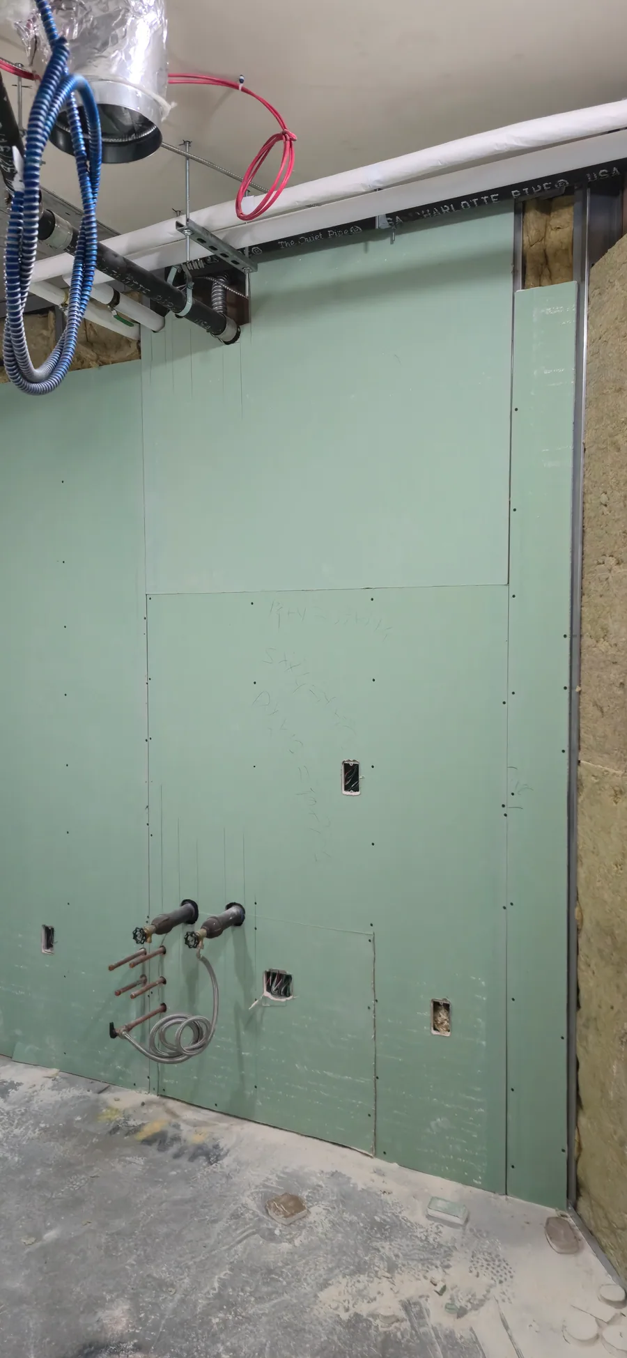 Moisture-resistant wall board installed around mechanical and plumbing openings